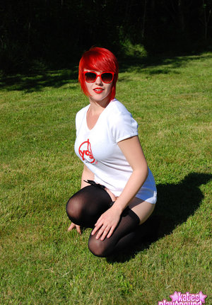 18 year old girl Katie Lewis stands naked after undressing in her bedroom